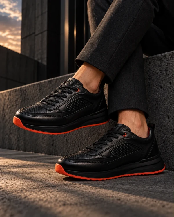 Tenis 3205 Eva Runner Negro con Naranja — Sentado · tobillos cruzados